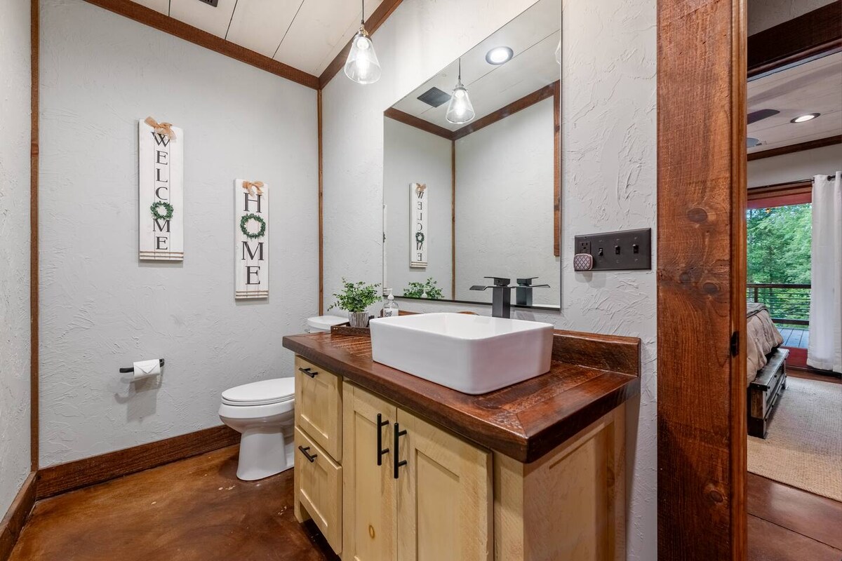 Lower-level bathroom. Across from bedroom and game room.